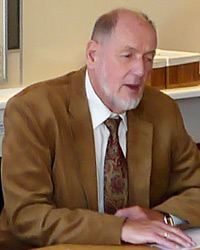Photo of DRPI co-director Bengt Lindqvist wearing a beige suit
