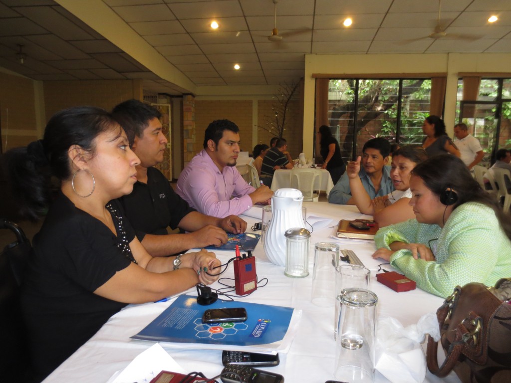 Workshop participants sitting around a table.